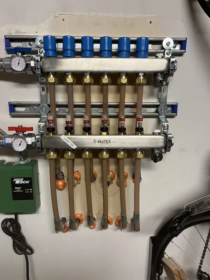 Plumber performing Water Heater Repair at a residential property in College Park